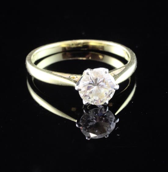 An 18ct gold, platinum and solitaire diamond ring, size M.